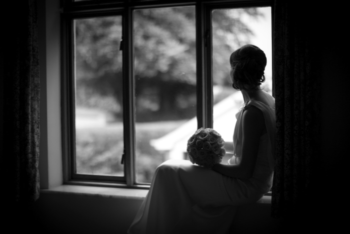 bride in window black and white